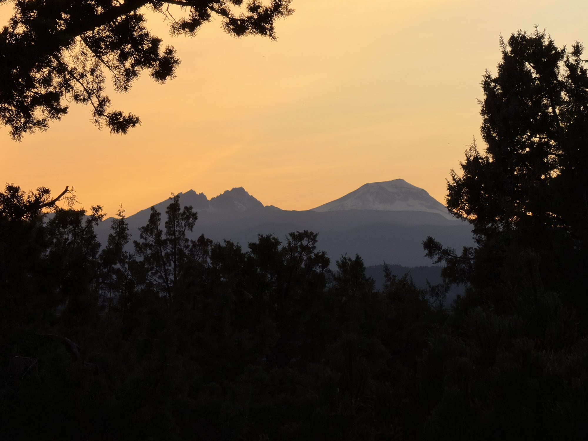 Silhouette of the Three Sisters peaks at sunset